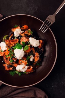 Warm Salad with crispy eggplant and tomatoes, cottage cheese, spices, herbs, sesame seeds,