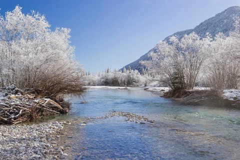 Isar valley in winter at temperatures of minus 18 degrees Celsius. Snow covered landscape with the