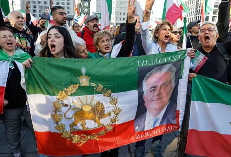 Iranians demonstrate with a poster of Prince Reza Pahlavi on the day of the US and Israeli attack