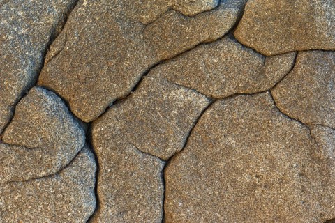 Stone with cracks, weathered rock by the sea, Quiberon, Brittany