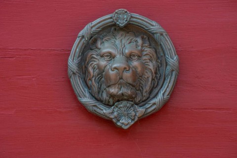 Lion's head as a door knocker in Ystad, Skåne county, Sweden, Scandinavia