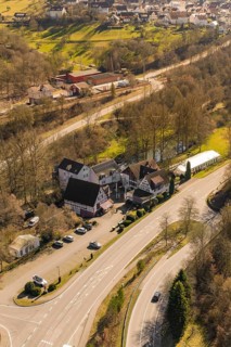 Building on a rural road with parking lot and surrounding trees, Pfrondorf, Nagold, Calw district,