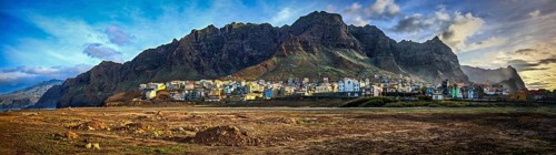 Wide view, panorama of Ponta do Sol, a picturesque coastal town with mountains in the background,