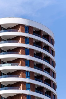 A modern architectural marvel showcasing the seamless integration of glass and concrete, creating a