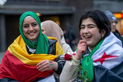 Syrian woman celebrate the end of the Assad regime after the change of power in Syria at a rally on