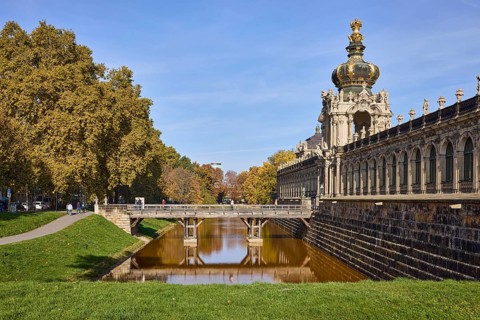 Dresden Zwinger, Crown Gate with bridge, moat, reflections on the water surface, trees, Dresden,