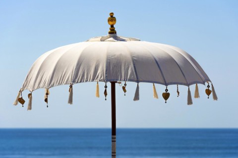 Traditional Balinese temple sunshade as parasol, sun, Hinduism, symbol, beach holiday, protection,