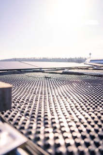 Detailed view of the structured surface of a solar roof in sunshine, PV installation at OBI