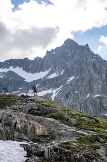 Mountaineer on a hiking trail, ascent to Schönbichler Horn, rocky summit Furtschaglspitze in the