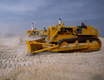 Oil industry in the Ras Tanura area, Saudi Arabia, D6H Tracked bulldozer in desert construction
