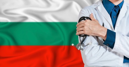 Doctor With Stethoscope On Bulgaria Flag. Doctor Holding Stethoscope On Bulgaria Flag