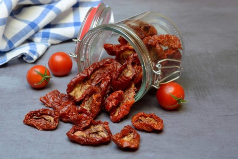 Dried tomatoes in glass containers, Solanum lycopersicum