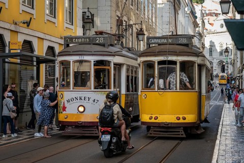 LISBON, PORTUGAL - MAY 19, 2025: Famous tram number 28 at the street of Lisbon