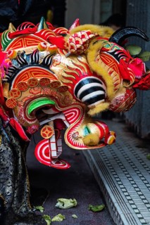 Close-up of a colorful dragon mask worn during the Chinese New Year festivities in Hong Kong. The