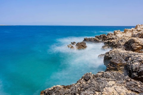 Romantic view over the sea in Koromacna Bay on a sunny day with rough seas on the island of Cres,