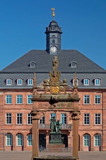 Neustadt Town Hall with the Brothers Grimm National Monument seen through the market fountain,