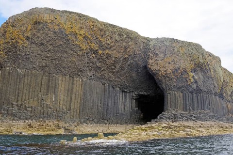Imposing cave with basalt columns on the coast, creating a mystical atmosphere, Fingal's Cave,