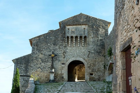 Banon. 15th century gate of the fortified enclosure listed as a historic monument.
