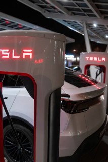 Tesla's rear view at a charging station at night, Tesla, Leonberg, Germany