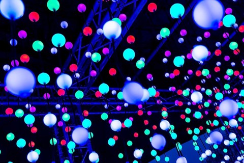 Light, glowing balls, LED lamps, hang in series, side by side, on top of each other, change their