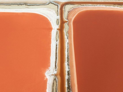 Saline ponds at the Bonanza salt works near Sanlúcar de Barrameda. The reddish colour depends on