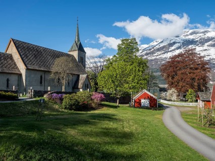 Church of Ullensvang near Lofthus, Hardangerfjord, springtime, snowy mountain, Norway