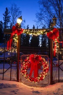 Christmas decorated entrance of a Bed and Breakfast at dusk, Delta Junction, Alaska, USA