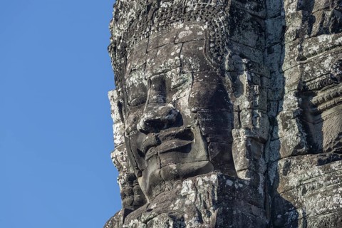 Giant stone-carved face of the Bodhisattva Lokeshvara, also known as Avalokiteshvara, Bayon Temple,