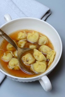 Cappelletti, pasta with broth in shell, pasta