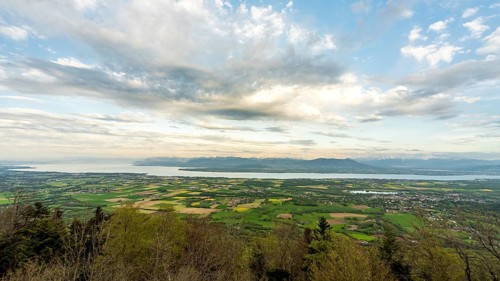 A breathtaking landscape featuring the expansive views of the Alps and Lake Leman, captured from a