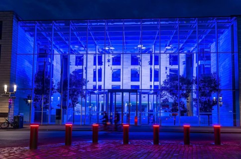 Historic old town, blue illuminated building of the Münster district government, illuminated