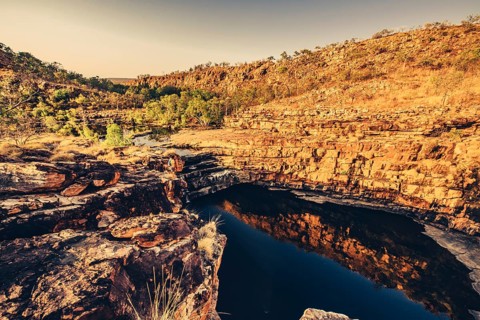 Bell Gorge waterfall, a body of water in north-west Australia in the Kimberley. Sunrise in the
