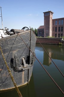 Bow of old canal boat on the river Leie, Kortrijk, Flanders, Belgium