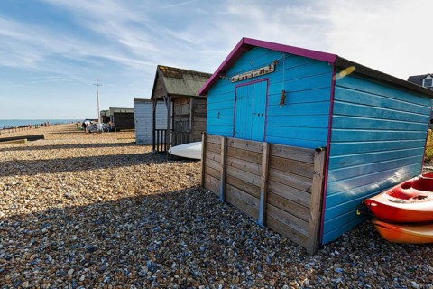 Colourful beach huts on a shingle beach, Cirrus, Kingsdown Beach, English Channel, Dover, Kent,