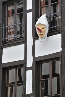 Blanc Moussis mask hanging from house front at Stavelot, Ardennes, Belgium