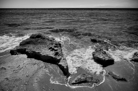 Rocks on the beach of Nea Kallikratia, Chalkidiki, Halkidiki, Macedonia, black and white, Greece