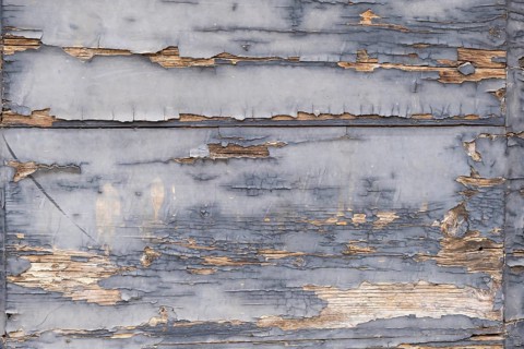 Old wooden door with peeling paint, texture, background, Apulia, Italy
