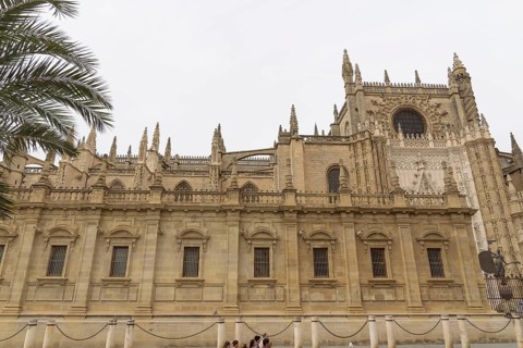Gothic cathedral with impressive façade and towering towers, Seville, Andalucia, Spain