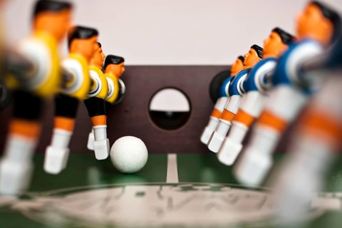 Football table players and balll close up