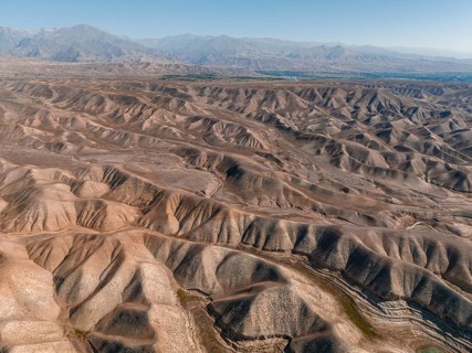 Top-Down, Barren landscape, Aerial view, Erosion landscape with canyons, Toktogul, Kyrgyzstan