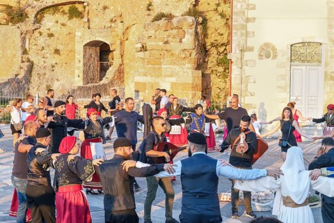 Group of people performing traditional Greek dance, Chania, Crete, Greek Islands, Greece