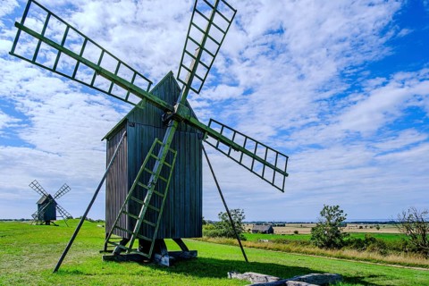Three traditional historic windmills (Resmo väderkvarnar) in the village of Resmo on Öland, Kalmar