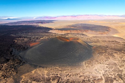 Aerial view of Antofagasta Volcano, showcasing its majestic crater and the surrounding arid