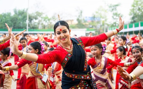 Participants with an instructor dance on the final day of a Bihu dance workshop ahead of Rongali