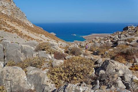 View of a rocky coastal landscape with blue sea, hike to the ancient Dorian city of Vrougounda and