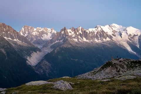 Evening mood with pink evening sky, mountain landscape at sunset, mountain peak Grandes Jorasses