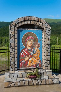 Mosaic of Holy Mary with the Child Jesus, framed by stones, Romanian Orthodox Monastery Cheia,