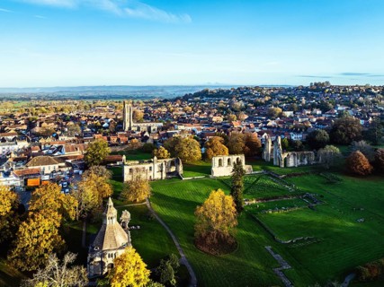 Sunrise over Glastonbury Abbey from a drone, Glastonbury, Somerset, England, United Kingdom