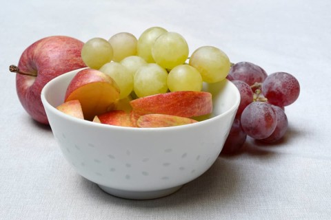 Apple slices and grapes in skin