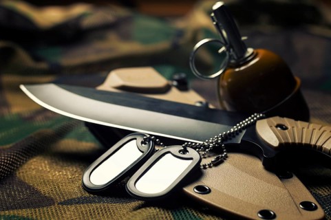Military tokens are on the knife. The concept of the army, war, political conflict. View from above